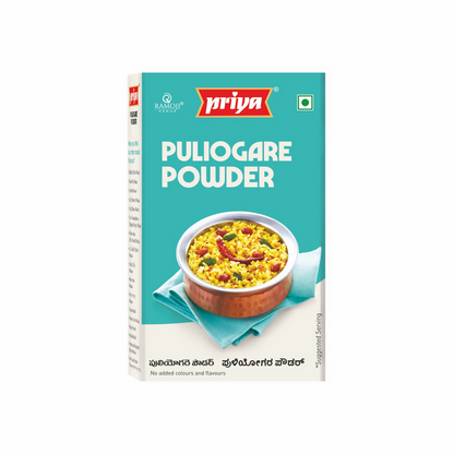 Box of Priya Puliyogare Powder with a bowl of food on a white background