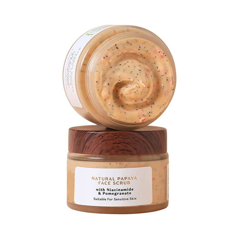 Two jars of Natural Papaya Face Scrub with wooden lids on a white background