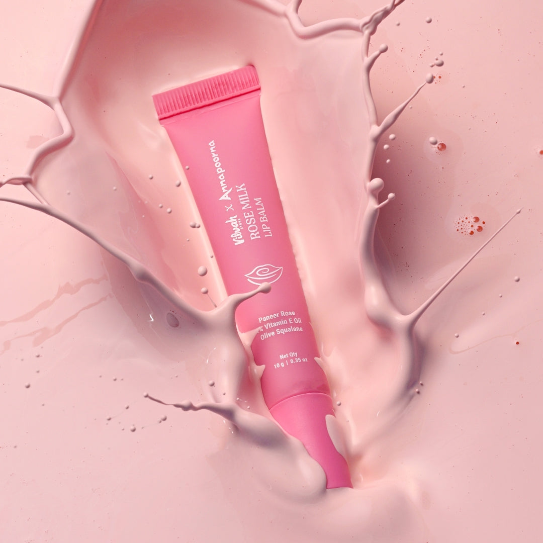 Pink lip balm tube on a pink background