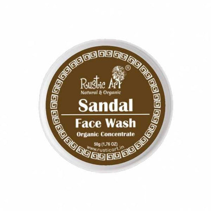Rustic Art Sandal Face Wash Organic Concentrate in a round brown bottle with a white cap, labeled with the brand and product details.