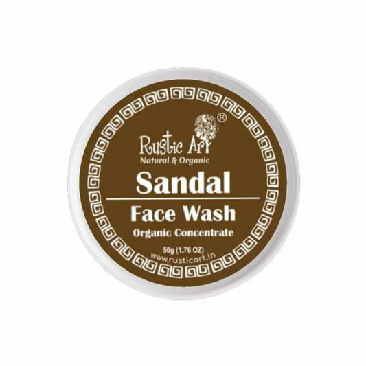 Rustic Art Sandal Face Wash Organic Concentrate in a round brown bottle with a white cap, labeled with the brand and product details.