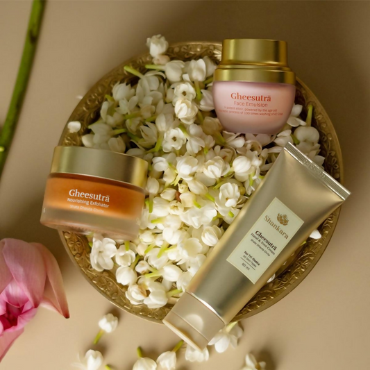 Gheesutra skincare products on a decorative plate with flowers