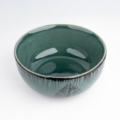 Green ceramic bowl on a white background