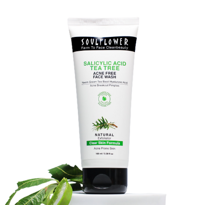 Soulflower Salicylic Acid Tea Tree Acne Free Face Wash tube with green leaves on a white background