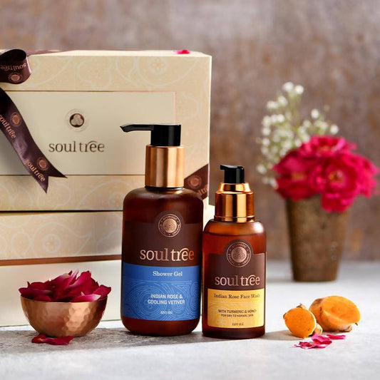 Two 'soultee' skincare products on a table with decorative elements.