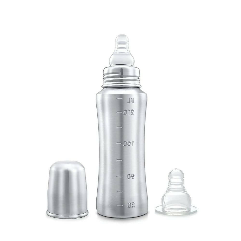 Silver baby bottle with accessories on a white background