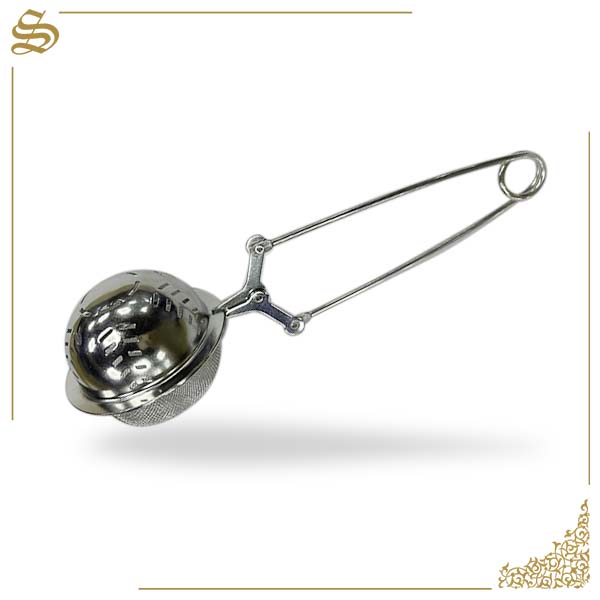 Metallic tea ball on a white background