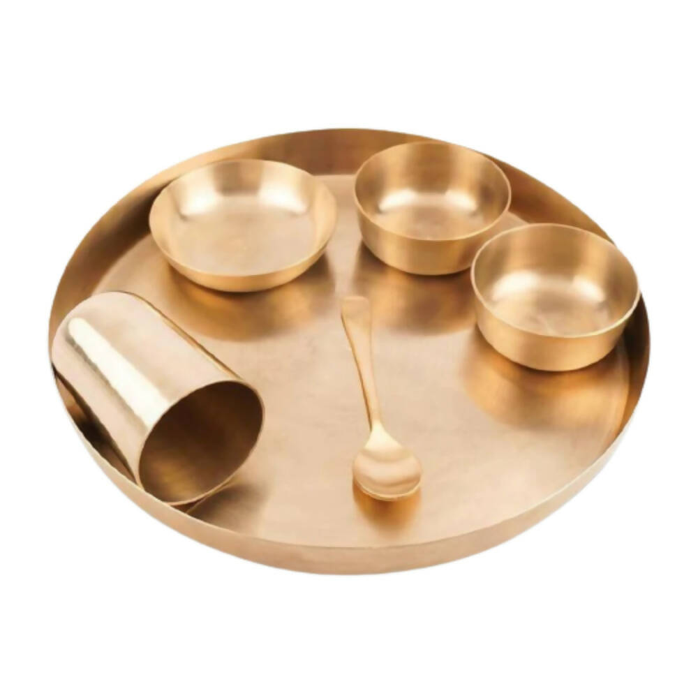 Gold tray with three bowls and a spoon on a white background