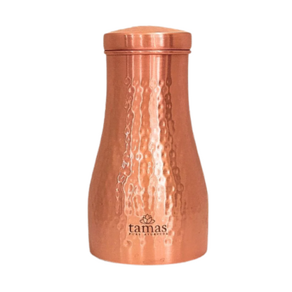 Copper tumbler with textured surface and 'tamas' branding on a white background