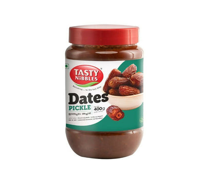 Jar of Tasty Nibbles Dates Pickle with a red lid on a white background