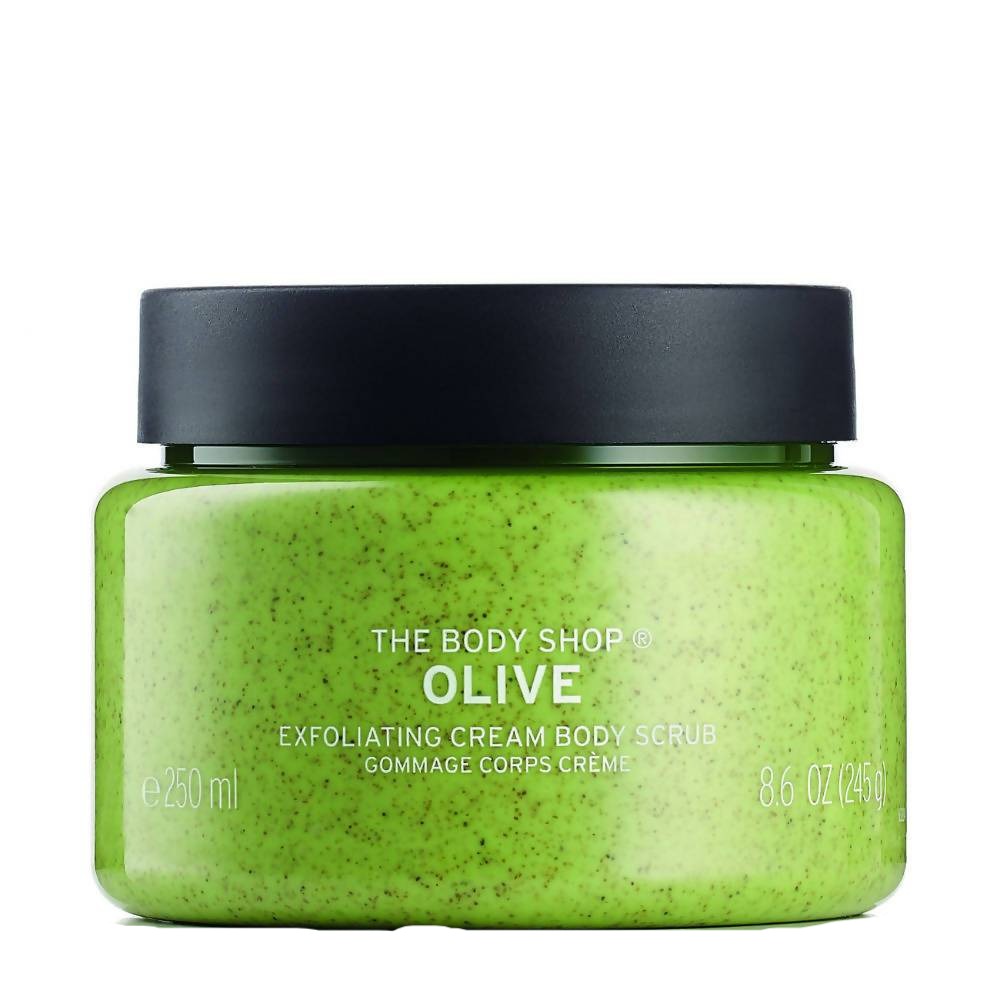 Green jar of The Body Shop Olive Exfoliating Cream Body Scrub with black lid on a white background