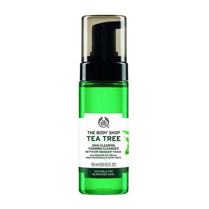 Green bottle of The Body Shop Tea Tree Skin Clearing Foaming Cleanser on a white background
