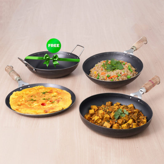 Four frying pans with different dishes on a beige background