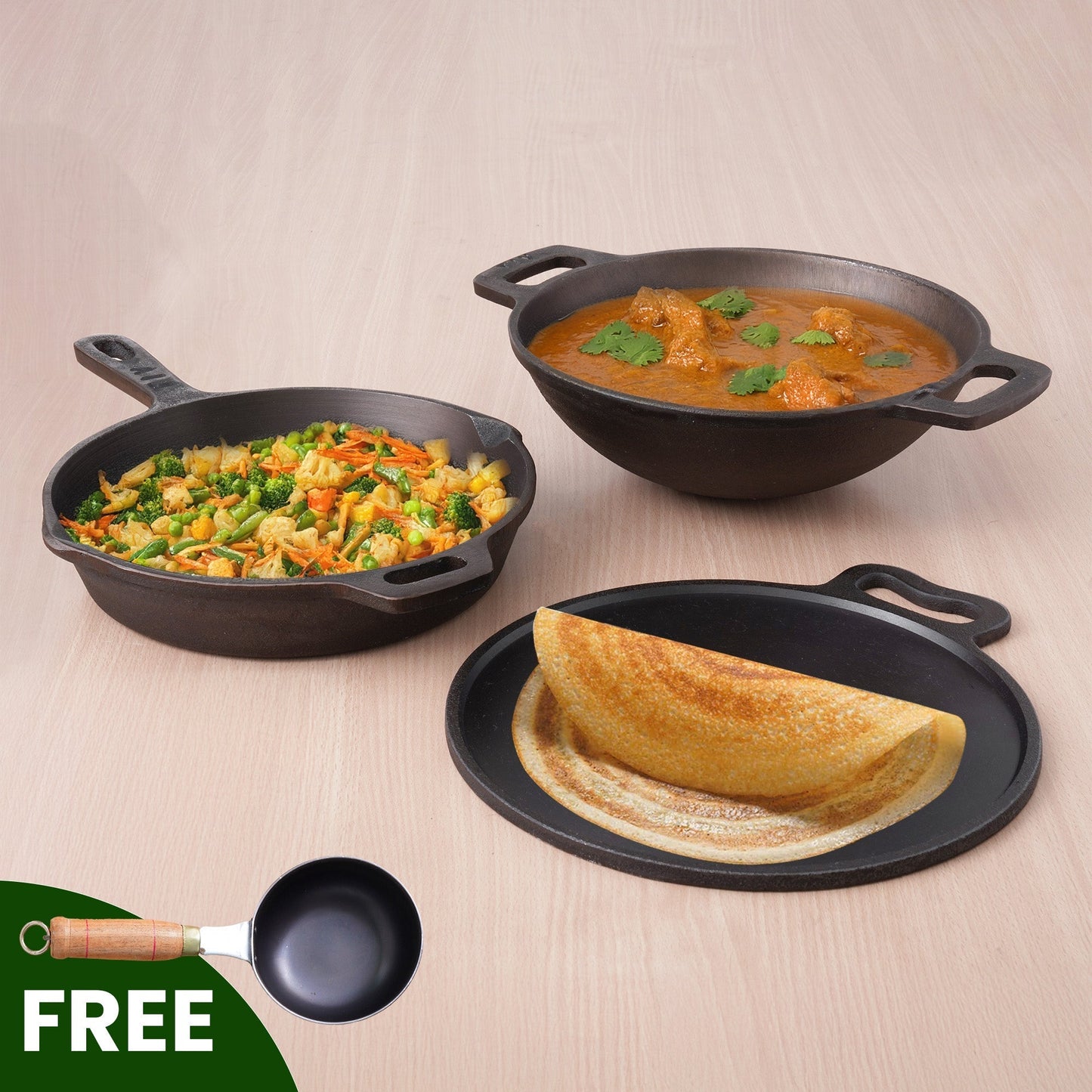Three black cast iron cookware items on a beige surface with a free ladle icon.