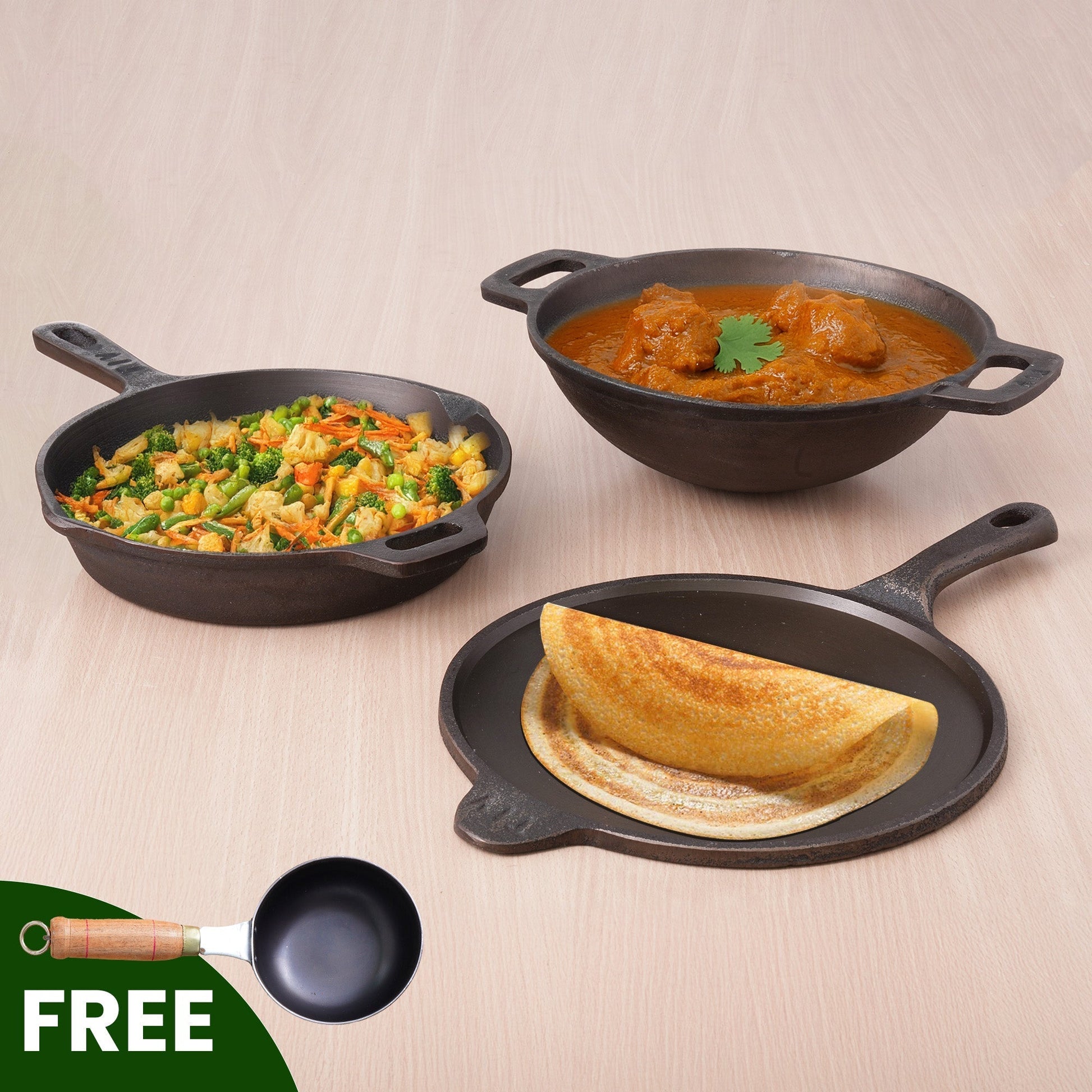 Three cast iron skillets with different dishes on a beige background