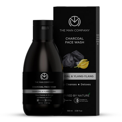 Black bottle and packaging of The Man Company Charcoal Face Wash on a white background