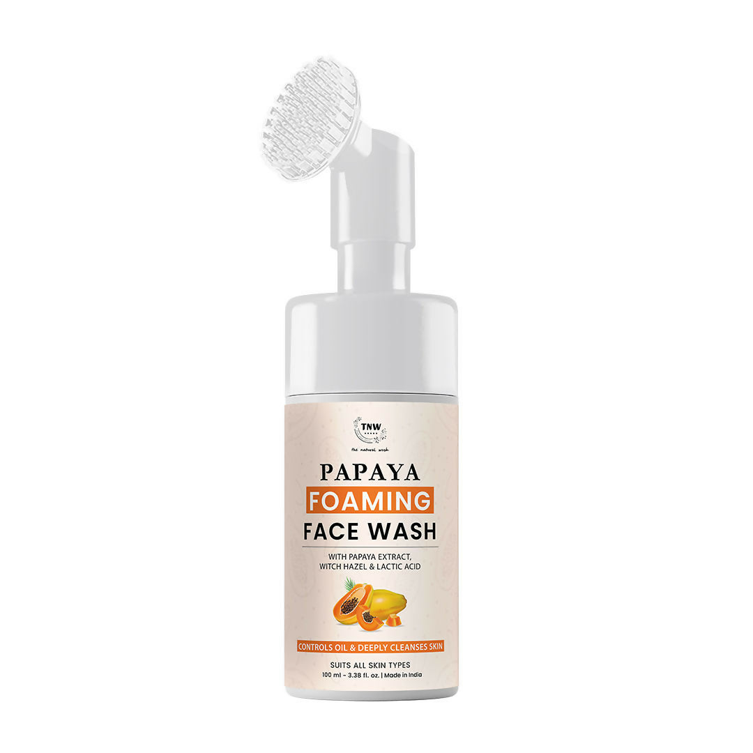 Papaya foaming face wash bottle with brush on a white background