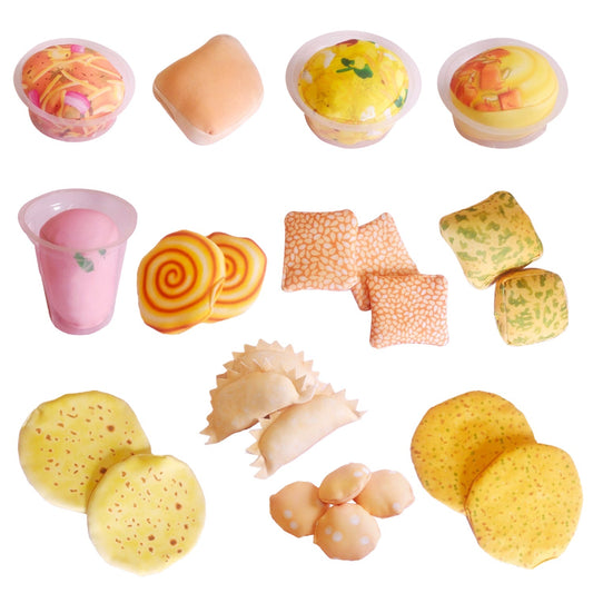 Assorted toy food items on a white background