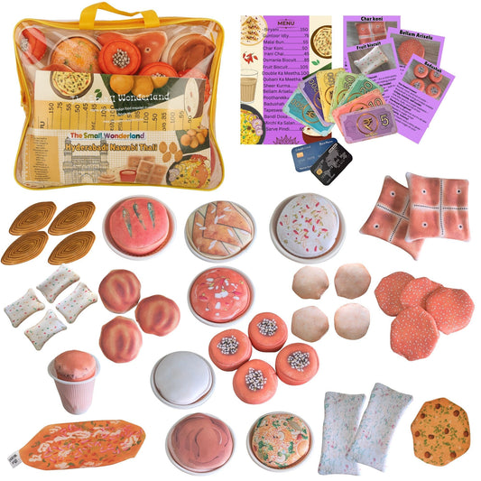 Collection of toy food items, packaging, and accessories on a white background