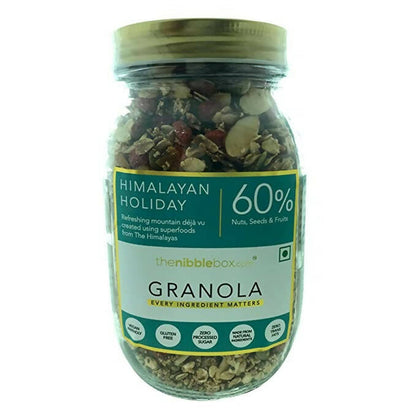 Jar of Himalayan Holiday Granola with a green label on a white background