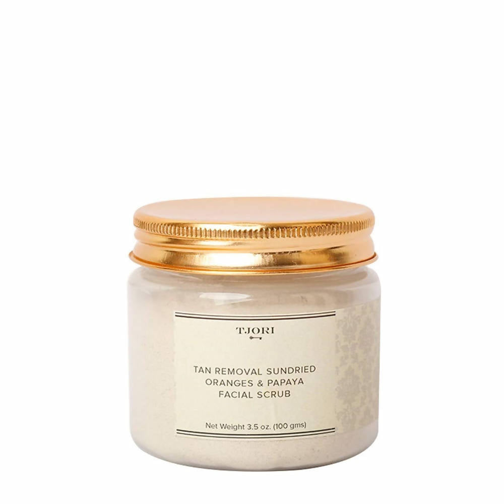 TJORI facial scrub jar with gold lid on a white background