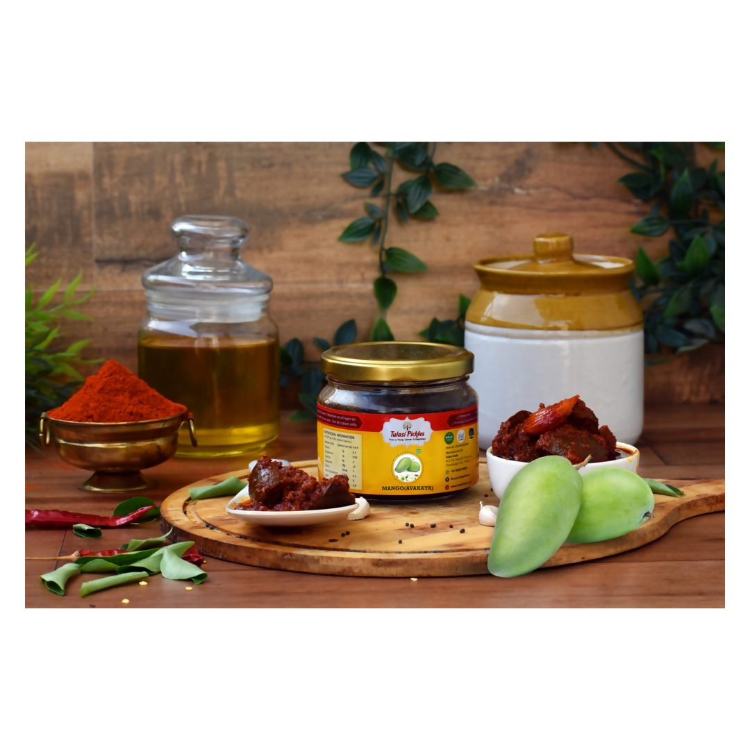 Spices, oils, and a jar on a wooden surface with a rustic background
