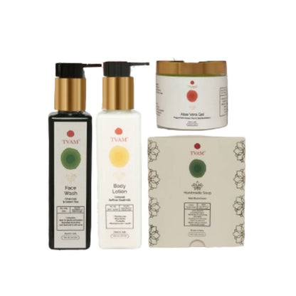 A collection ofTvam brand skincare products including a face wash, body lotion, aloe vera gel, and handmade soap, with packaging displaying Ayurvedic ingredients.