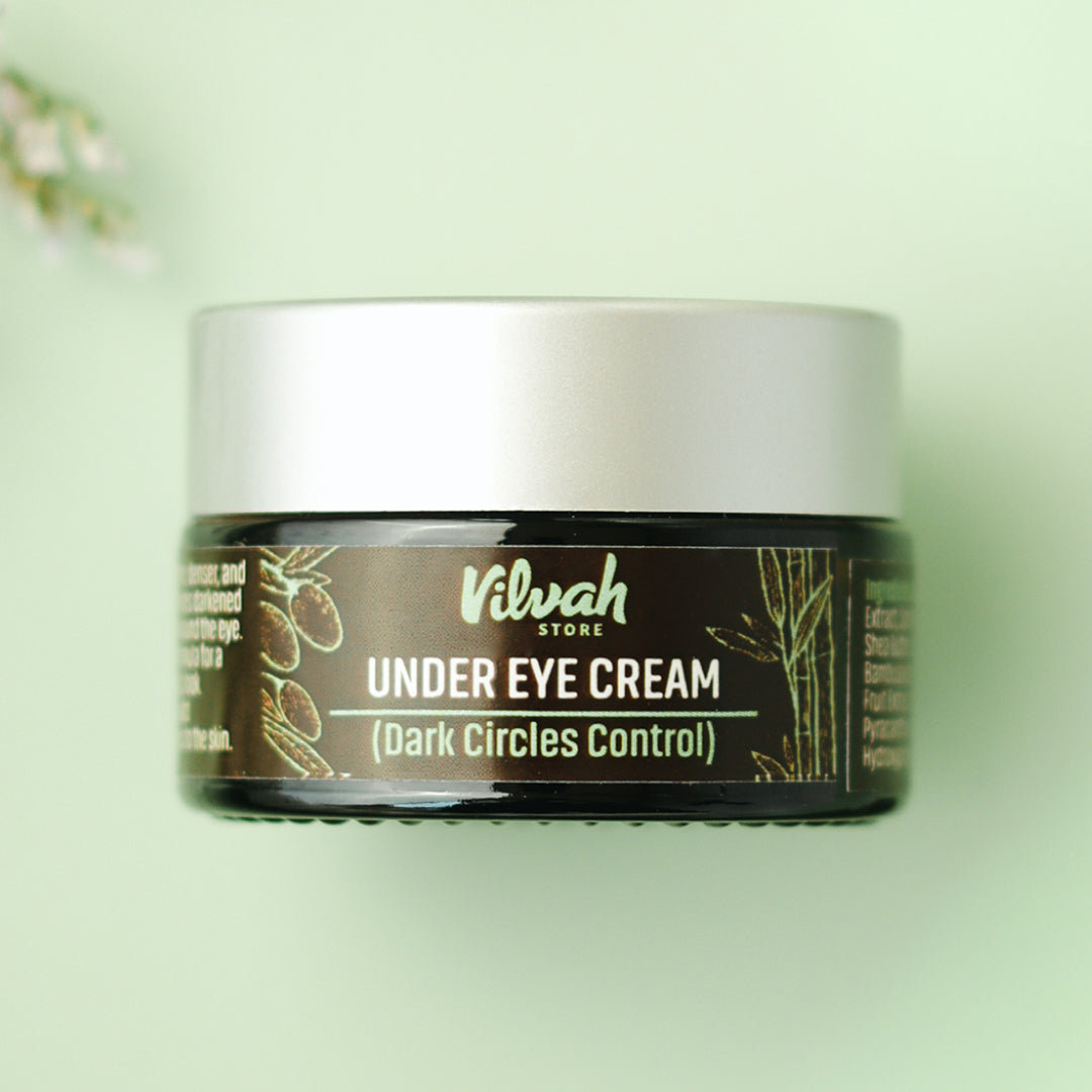 Jar of Vilvah Under Eye Cream on a light green background