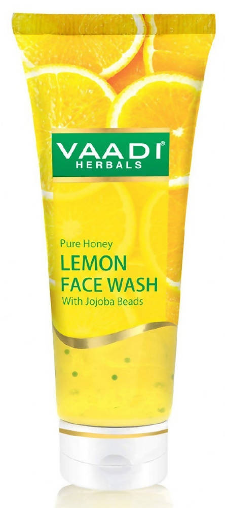 Vaadi Herbals Lemon Face Wash tube with honey and lemon slices on a white background