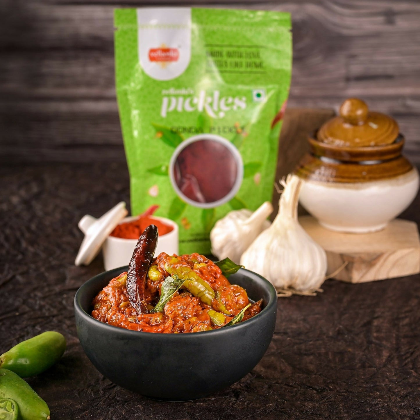  bowl of pickles with a green packet labeled 'pickles' in the background