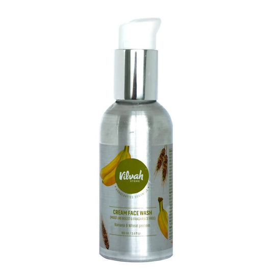 Silver bottle of cream face wash with banana and wheat design on a white background