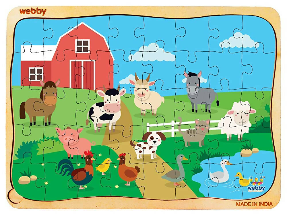 Children's puzzle with farm animals and a red barn, made by Webby.