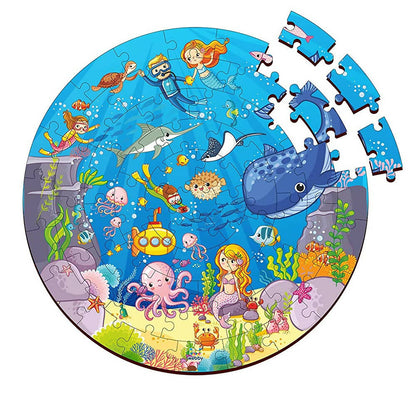 Round children's puzzle with an underwater theme featuring mermaids, fish, and sea creatures.