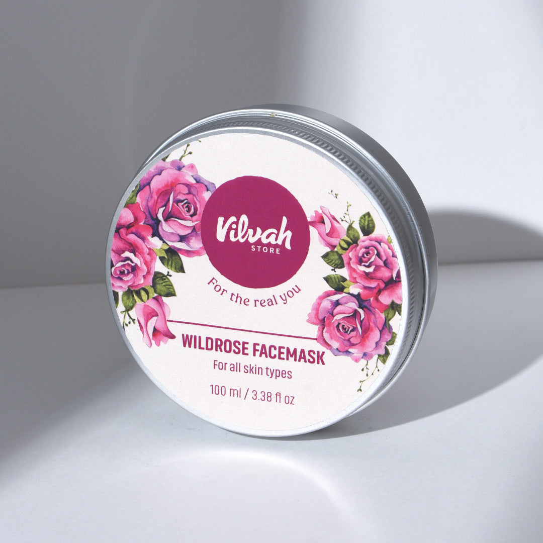 Wildrose facemask container with floral design and 'Vilvah' branding on a gray background