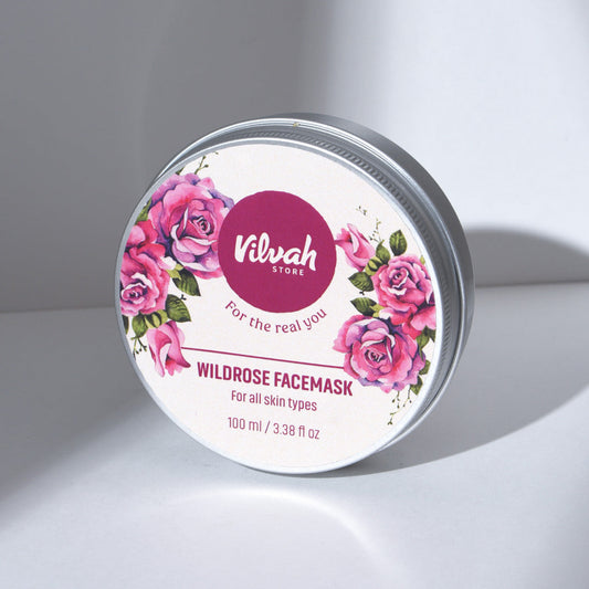 Wildrose facemask container with floral design and 'Vilvah' branding on a gray background