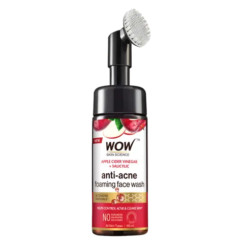 A bottle of WOW Skin Science Apple Cider Vinegar Foaming Face Wash with a brush applicator on top. The label has red and white colors with text and branding.