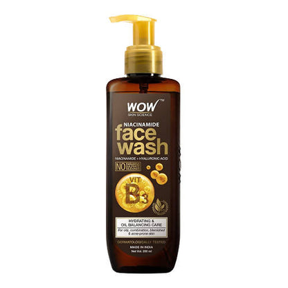 Brown bottle of WOW Niacinamide face wash with gold pump on a white background