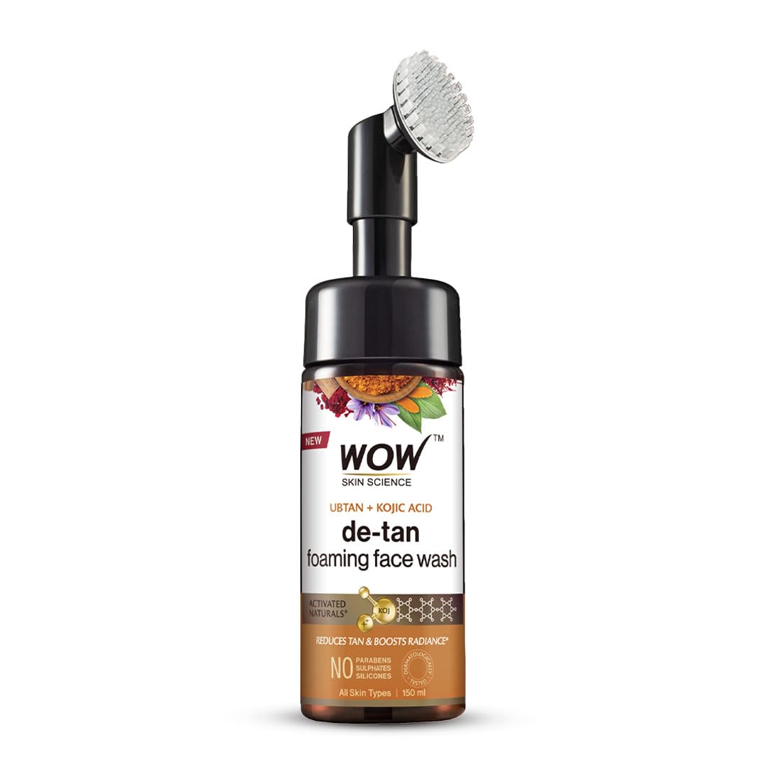 A bottle of WOW Skin Science Ubtan Foaming Face Wash with Turmeric & Saffron, featuring a built-in brush for deep cleansing, on a white background.