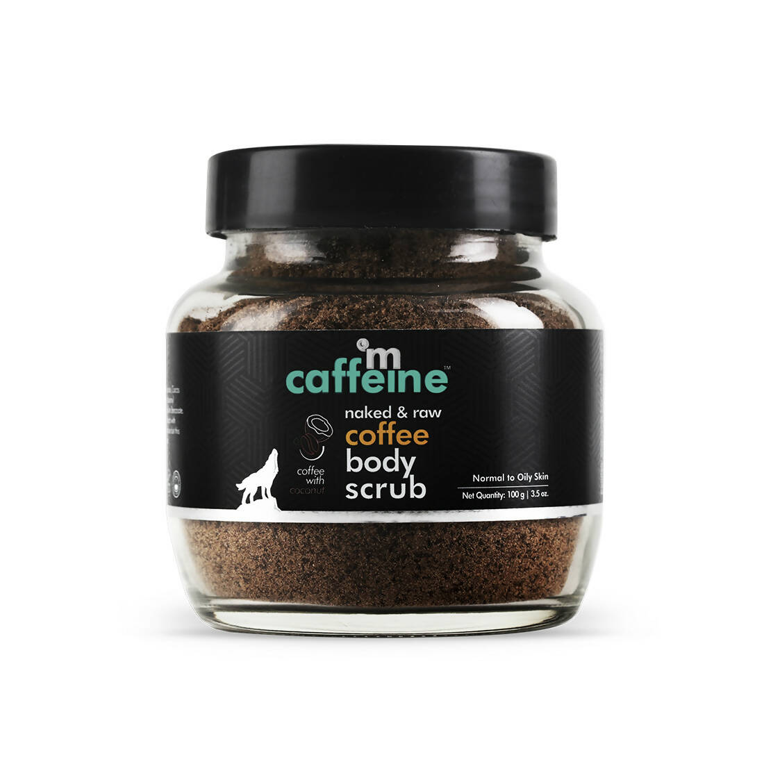 A glass jar containing mCaffeine Naked & Raw Coffee Body Scrub with a black lid and a label that includes the product name and a silhouette of a mountain.